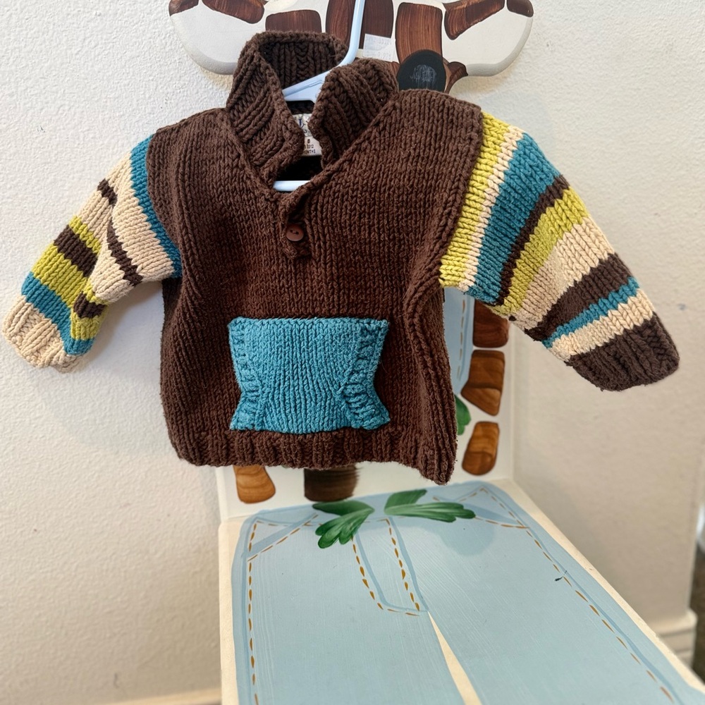 Brown Knit Baby Pullover with Teal Pocket and Striped Sleeves
